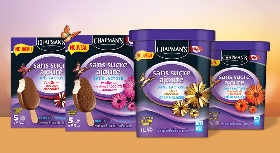 Chapman's 10 new products for 2022 arranged side by side on a wooden table with a bright summer sky and green trees in the background|Three of Chapman's Original Ice Cream boxes sitting on a wooden table