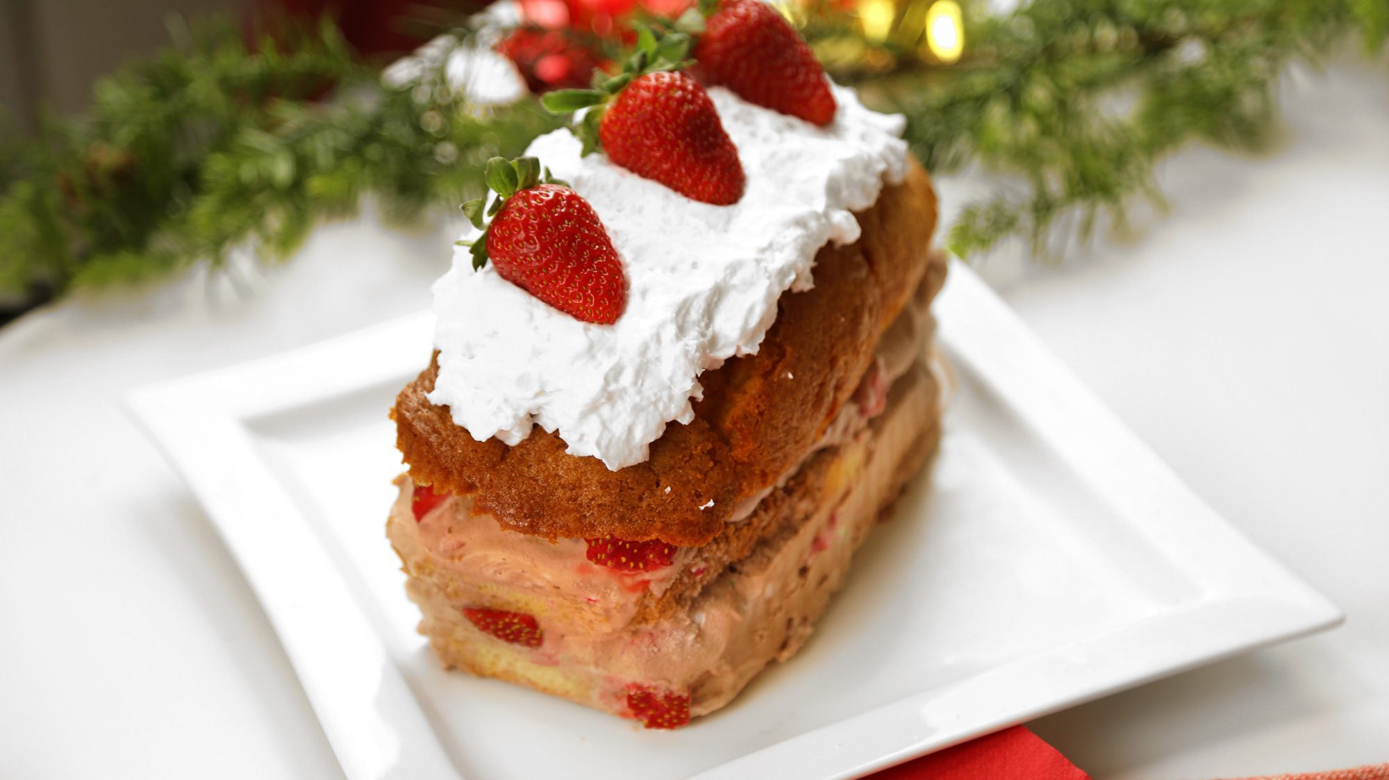 a layered peppermint chocolate ice cream cake made with with chapman's holiday moments peppermint twist